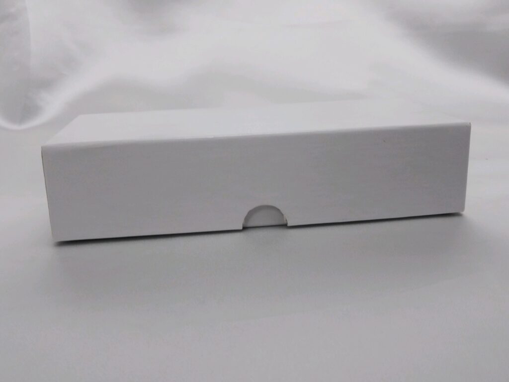 a white box with a ring on it