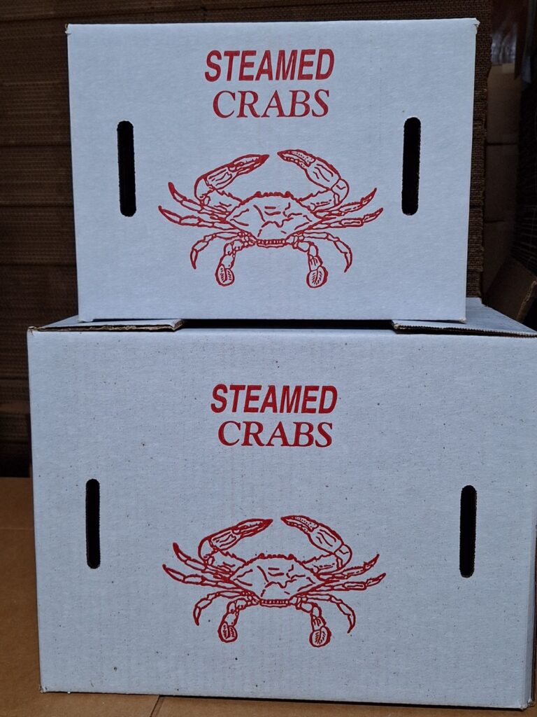 two white boxes with red crabs on them